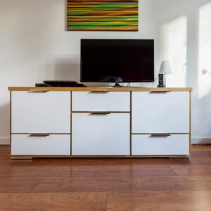black flat screen tv on white wooden cabinet